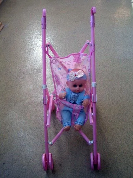 Toy pushchair with doll