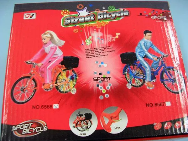 Plastic doll on a bicycle