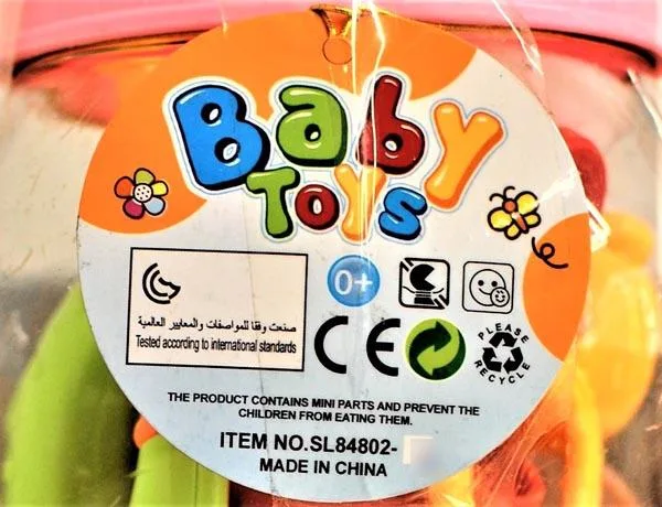 Baby bottle with teethers and rattles