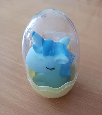Toy unicorn in a plastic egg