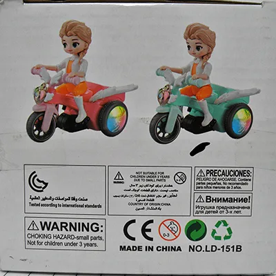 Toy doll on tricycle